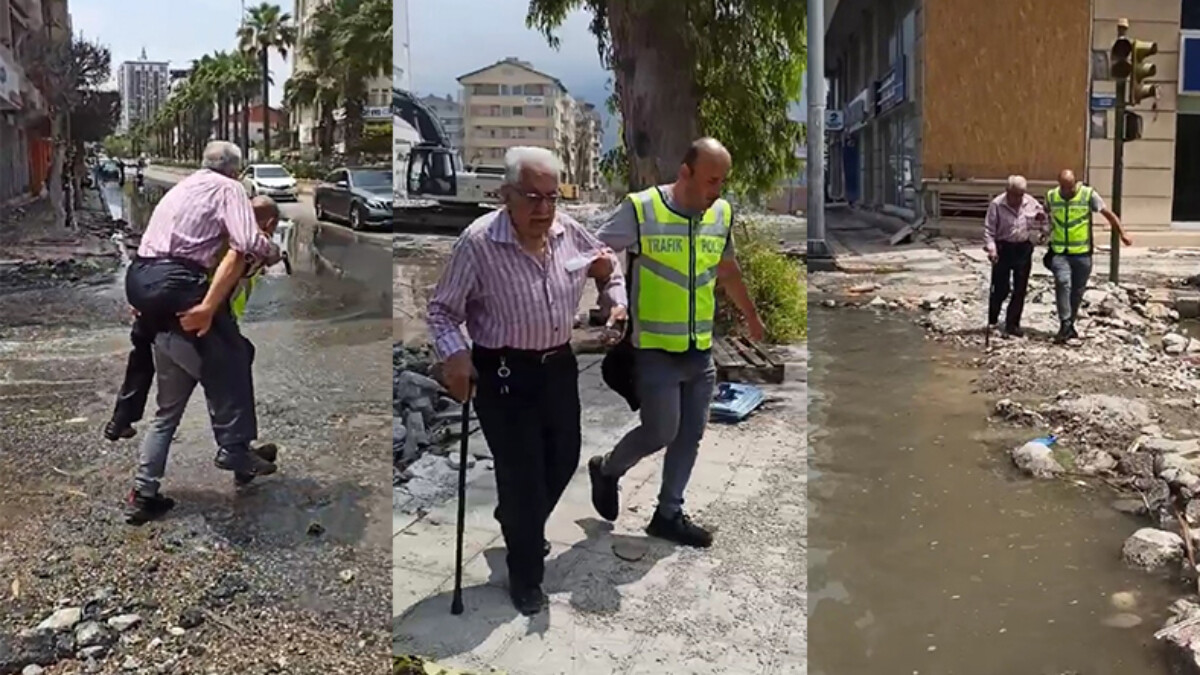 Hatay’da bir trafik polisi depremzedeyi su basan caddeden sırtında taşıyarak geçirdi