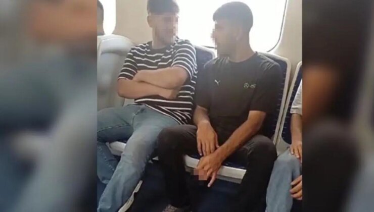 İZBAN’DA akılalmaz görüntüler! Kimseye aldırış etmeden sigara içti