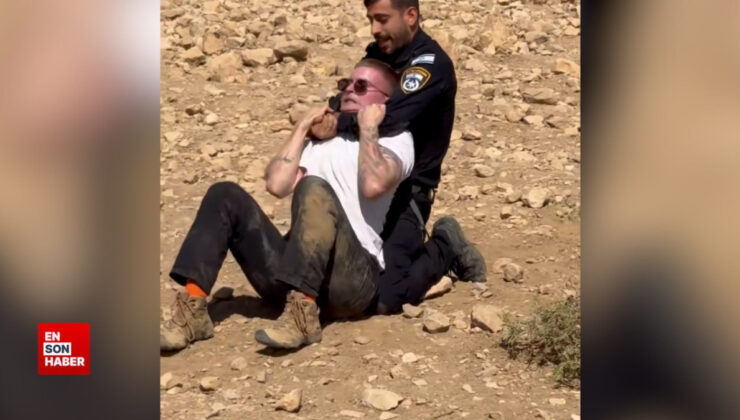 İsrail polisi, Filistin yanlısı eylemde bulunan İsrailli aktivisti darbetti