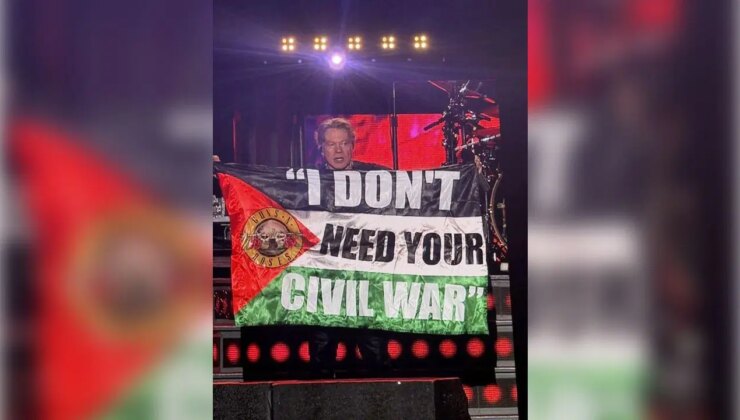 Ünlü rock grubunun solisti konserde Filistin bayrağı açtı