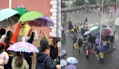 Öğrenciler yağmur altında Atatürk büstünü şemsiyeyle korudu