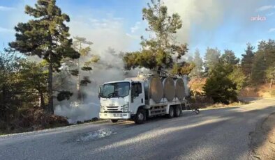 Orman yangınını fark eden yurttaş alevlere kamyonundaki sütlerle müdahale etti
