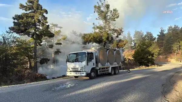 Orman yangınını fark eden yurttaş alevlere kamyonundaki sütlerle müdahale etti
