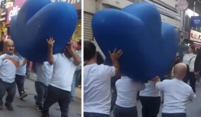 Vatandaşlar şaşkınlıkla izledi! Bir grup cüce cadde boyunca “F” harfi taşıdı