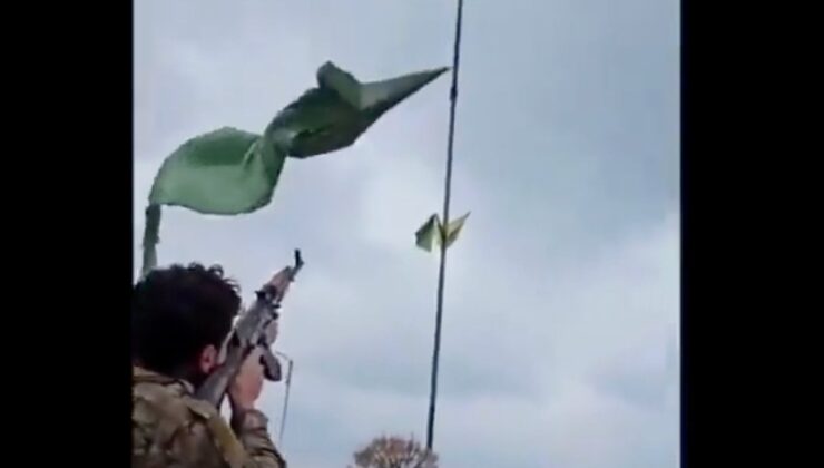 Suriyeli asker PKK/YPG paçavrasını silahla ateş ederek indirdi