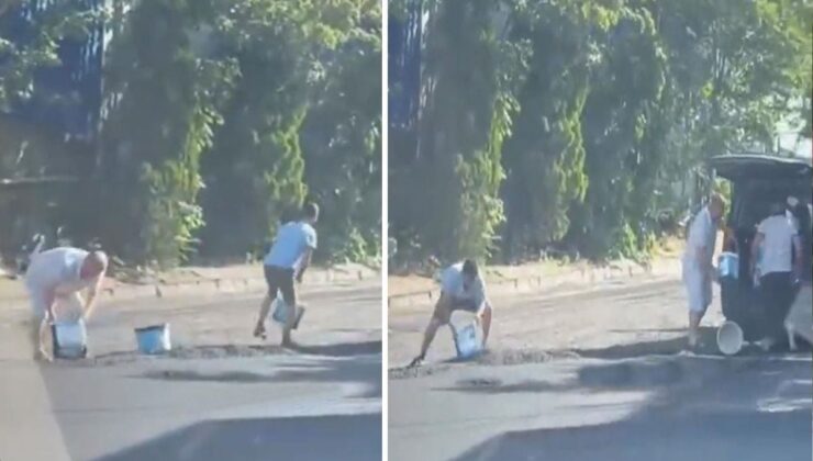 Yola yeni dökülen sıcak asfaltı kovalarla çaldılar