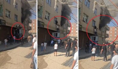 Yangında mahsur kalan kadını konteynerin üzerine çıkarak kurtardılar